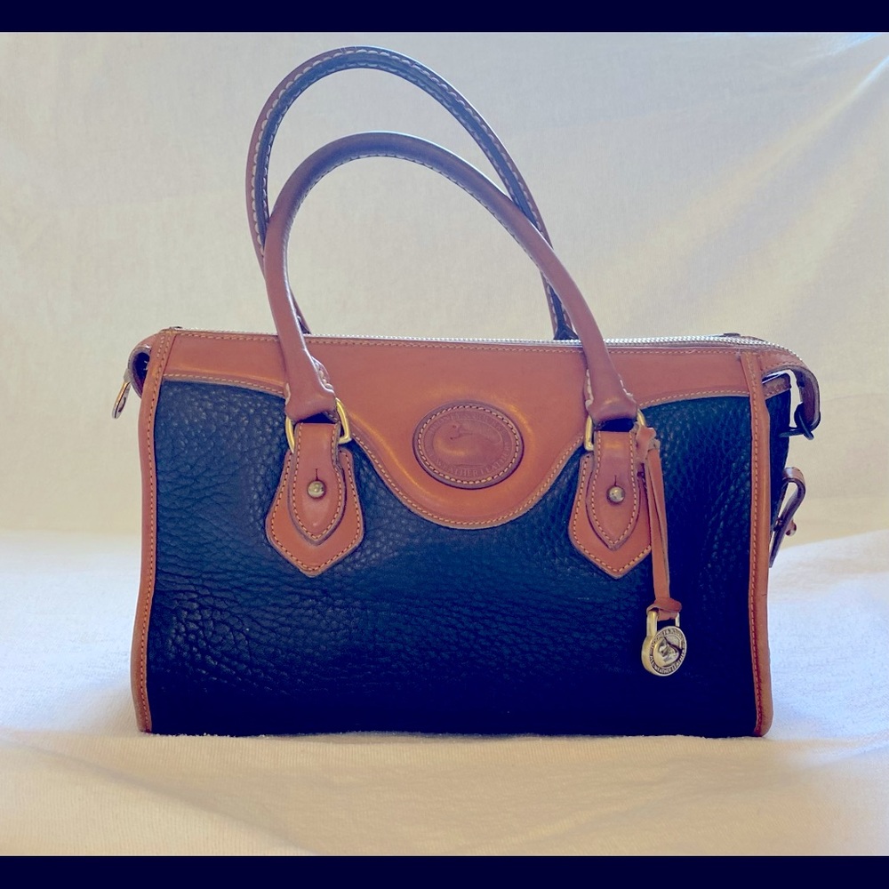 Dooney purse. Dark navy blue with rich tan trim. Used good condition.